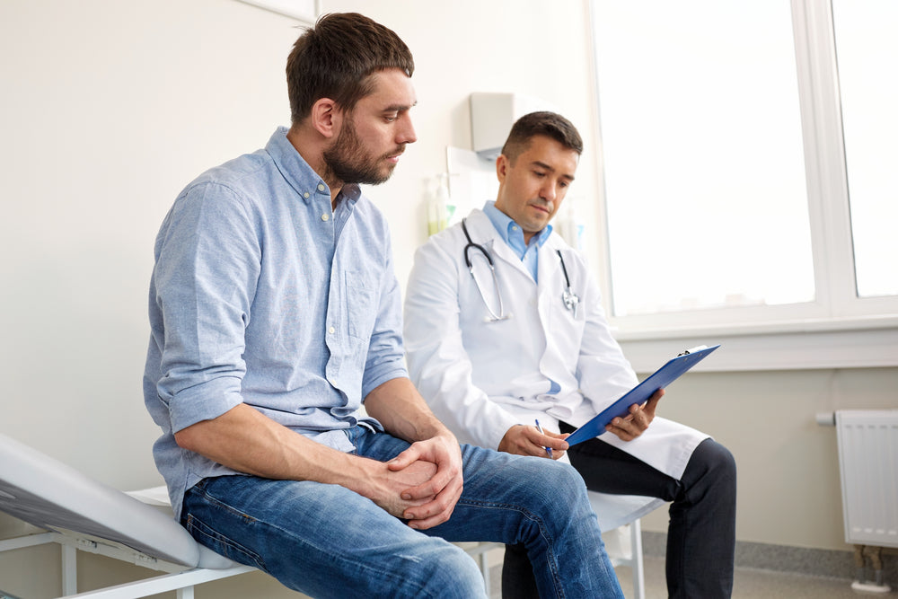 
          
            young male patient and his doctor discussing Testosterone Pellets vs Injections
          
        